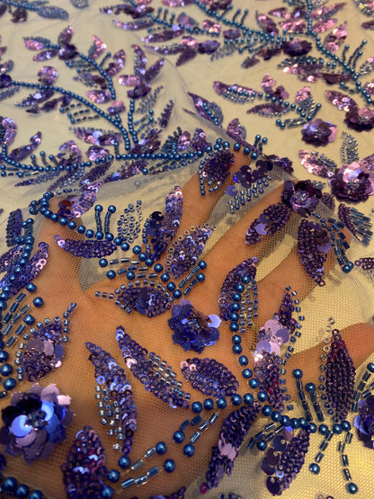 Broderie accesorizata cu paiete si margele albastre si mov , pe suport de tulle albastru